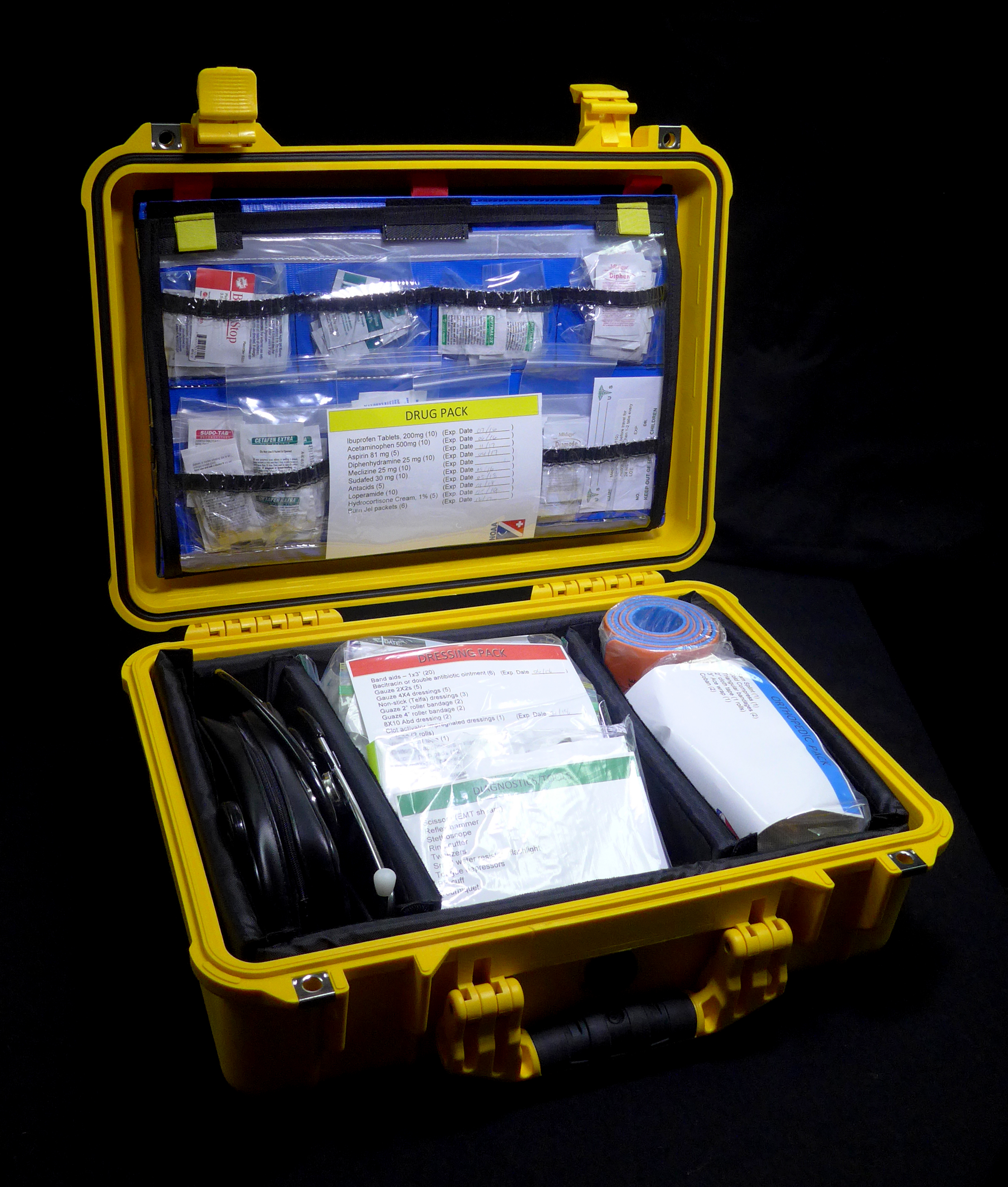 A first aid kit case opened with contents on display