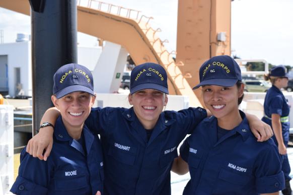 Three female NOAA Corps officer candidates aboard a NOAA ship