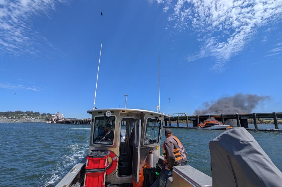 View from NOAA vessel of a boat on fire. Credit CDR Charles Wisotzkey