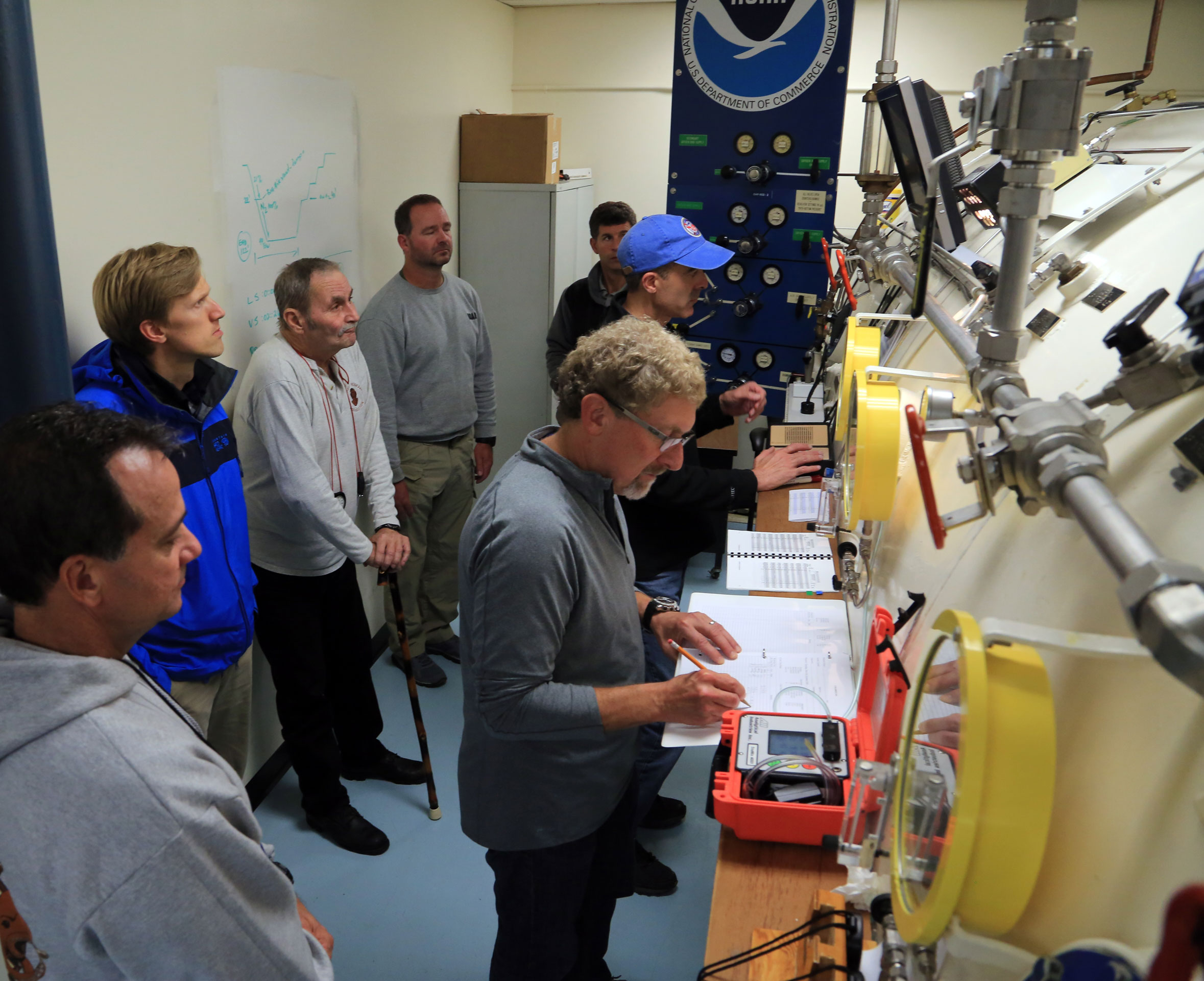 Students operating a hyperbaric chamber
