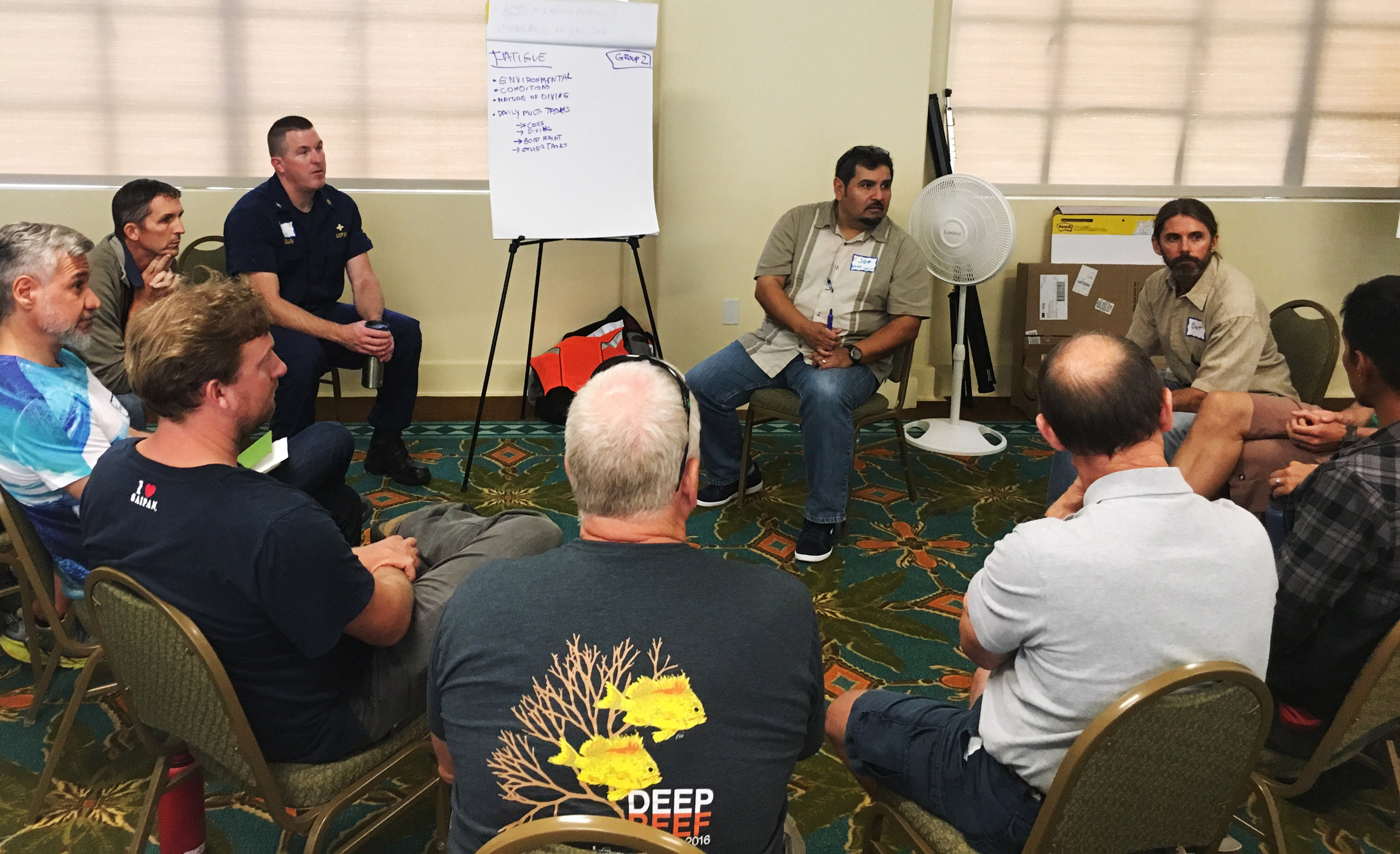 workshop attendees sit in a circle