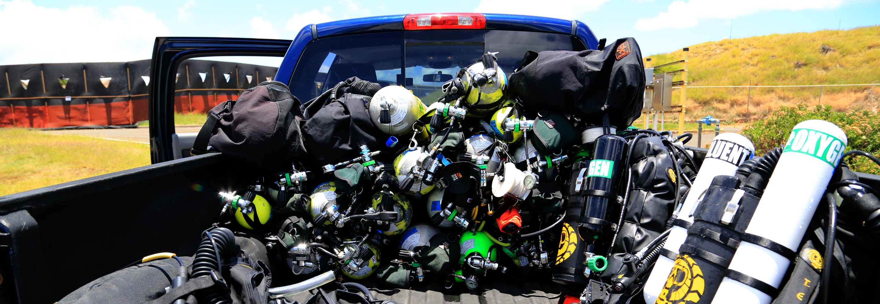 Pick up truck full of closed circuit rebreather bottles.