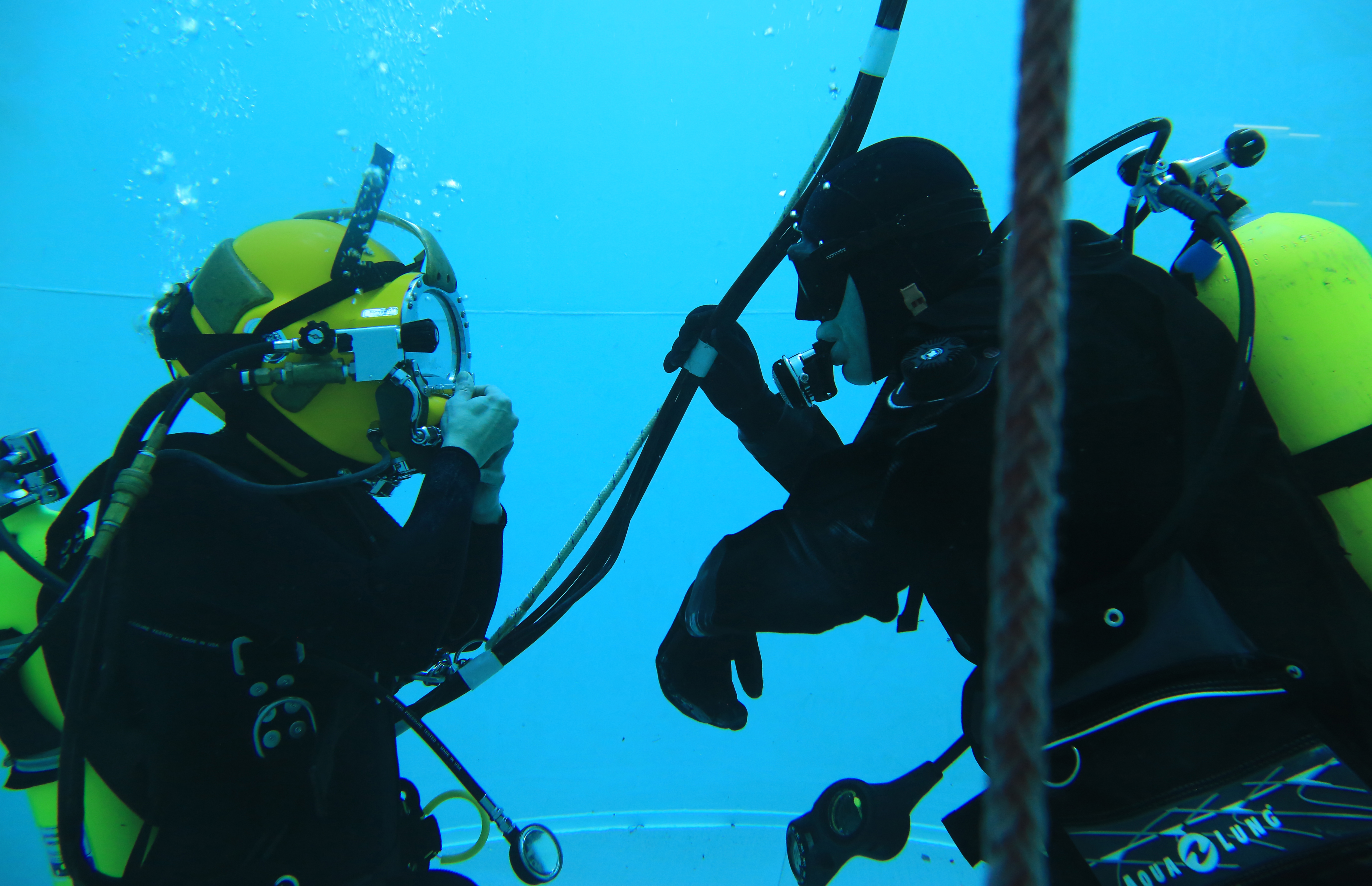 Two divers inside the NOAA diving training tank
