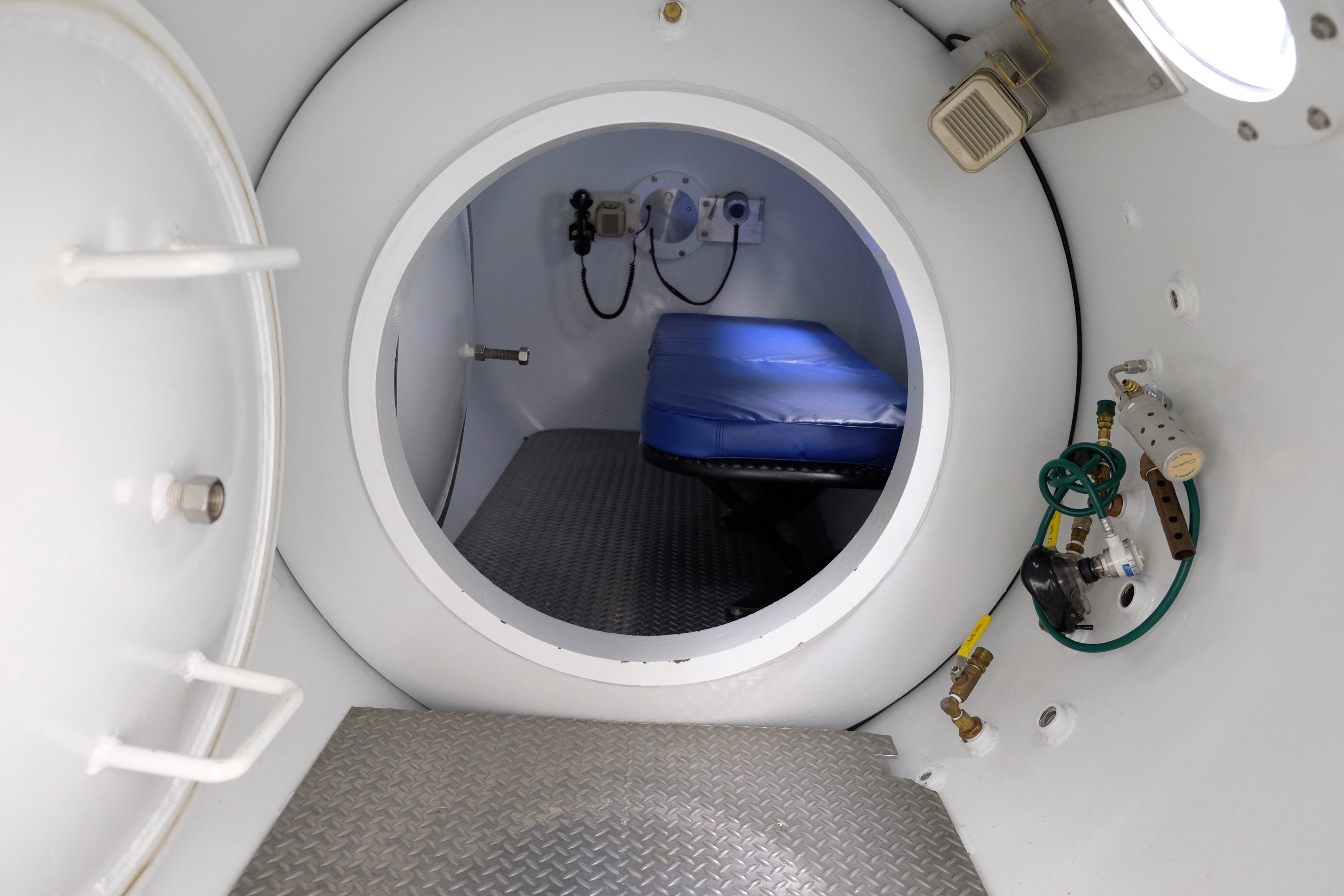 A view of the treatment bench inside a hyperbaric chamber.