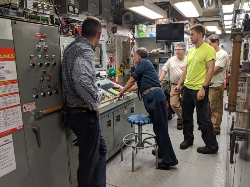Engineering department crew members aboard a NOAA ship
