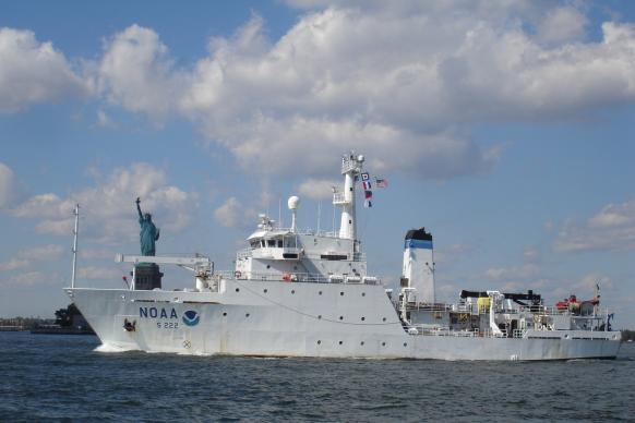 NOAA Ship Thomas Jefferson pictured with the Statue of Liberty