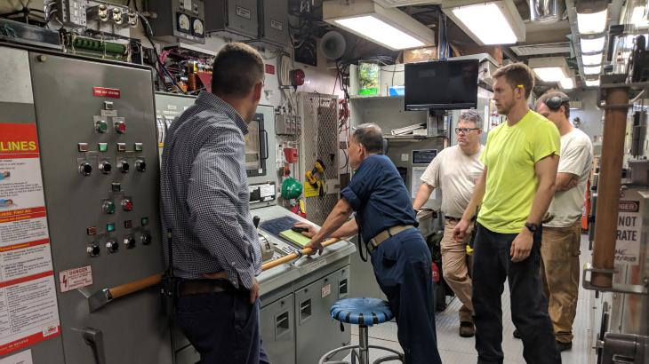 Engineering department crew members aboard a NOAA ship