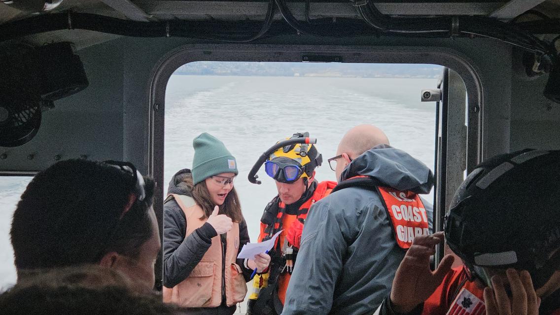 NOAA and US Coast Guard personnel practice skills for maritime emergencies.